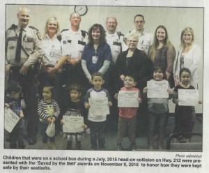 Children that were on a school bus during a July, 2015 head-on collision on Hwy. 212 were presented with the ‘Saved by the Belt’ awards on November 9, 2016 to honor how they were kept safe by their seatbelts.